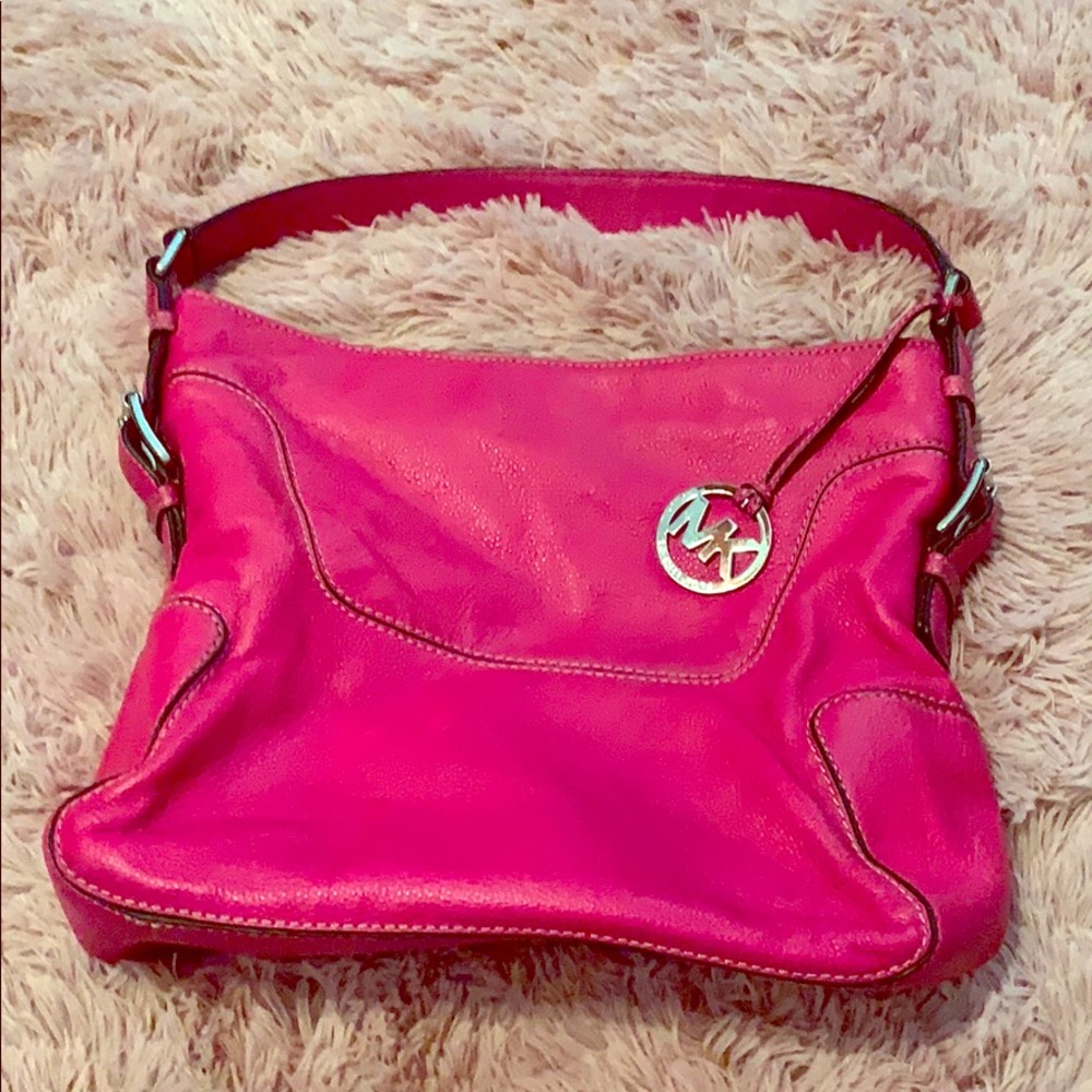 Hot pink Michael Kors bag.